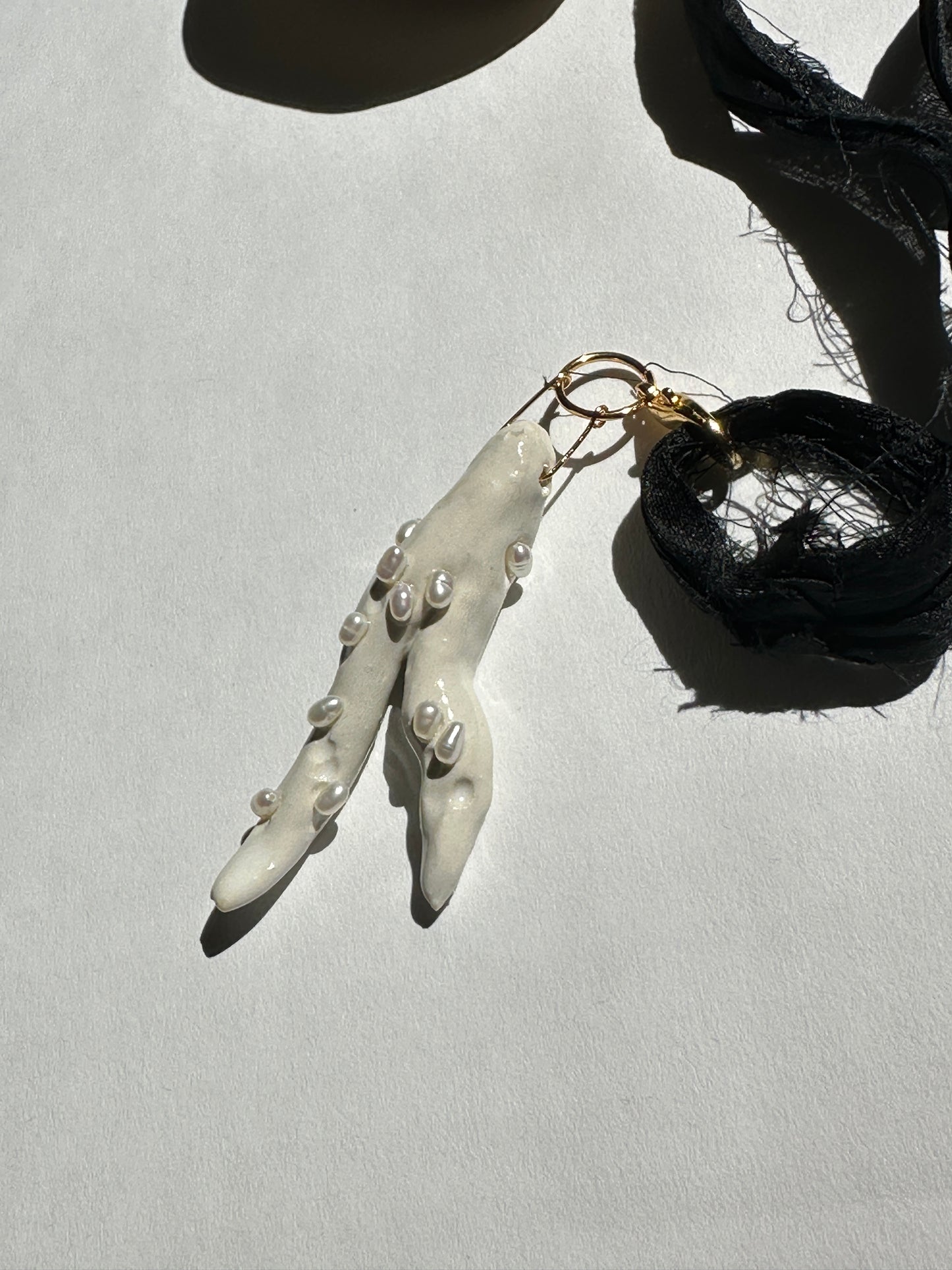 Pearl-Studded Ceramic Driftwood Pendant on Raw Silk Cord