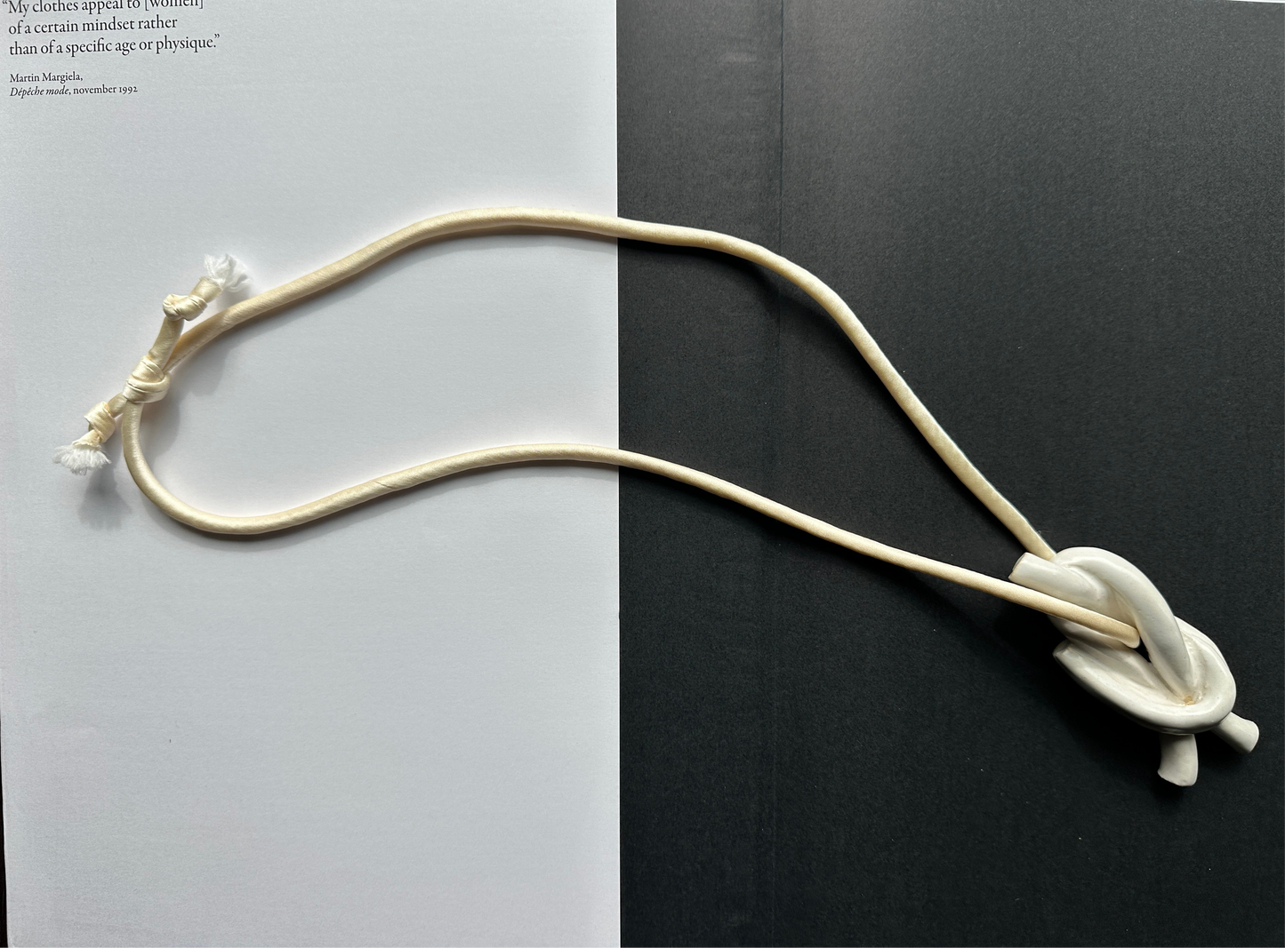 Ceramic knot pendant with ivory silk cord