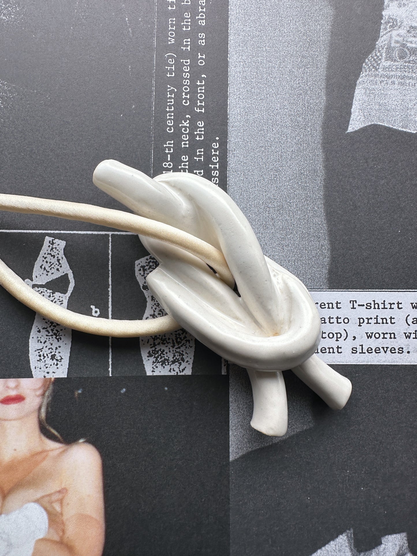 Ceramic knot pendant with ivory silk cord