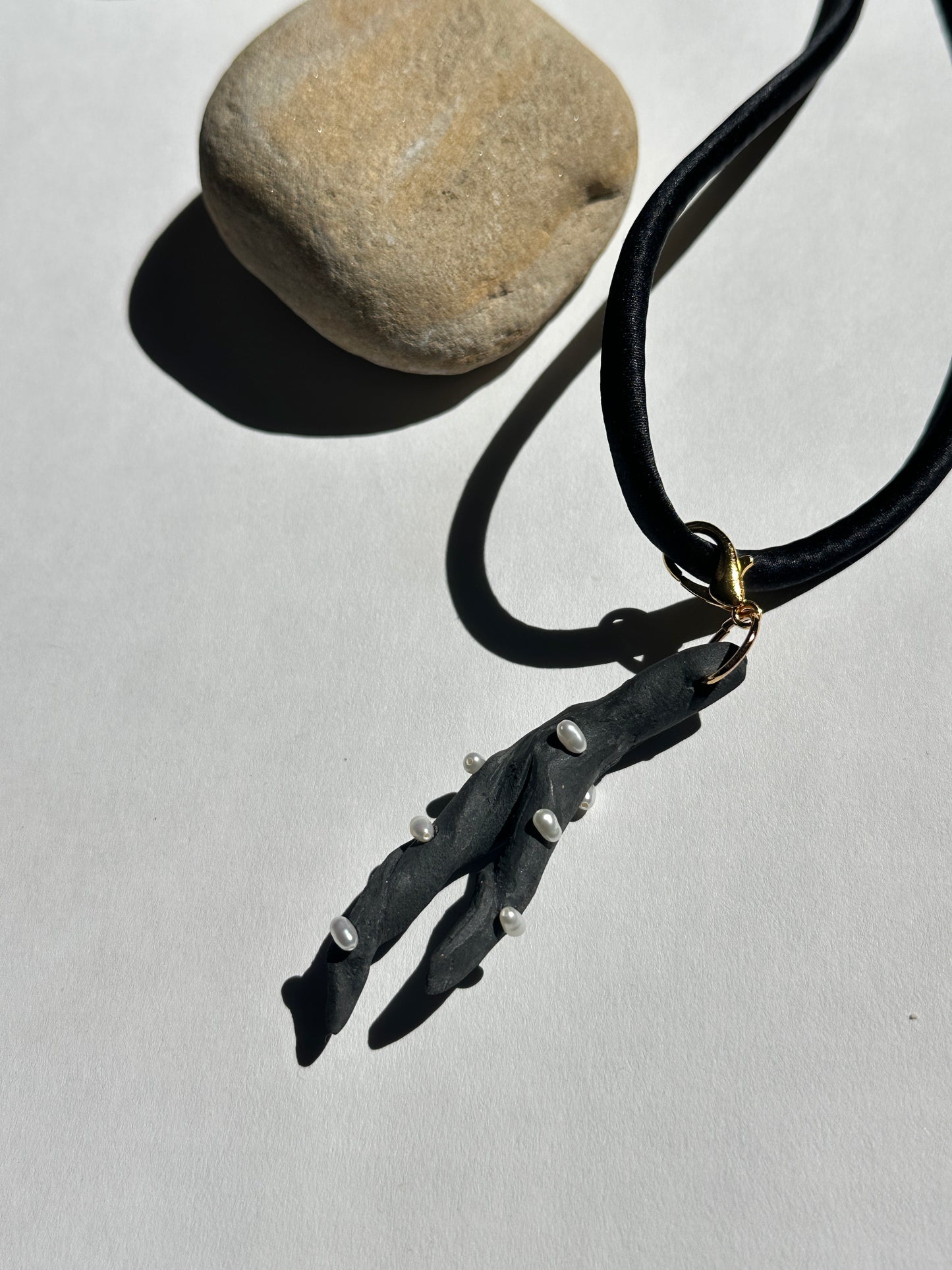 Pearl-Studded Dark Ceramic Driftwood Pendant on Black Silk Cord