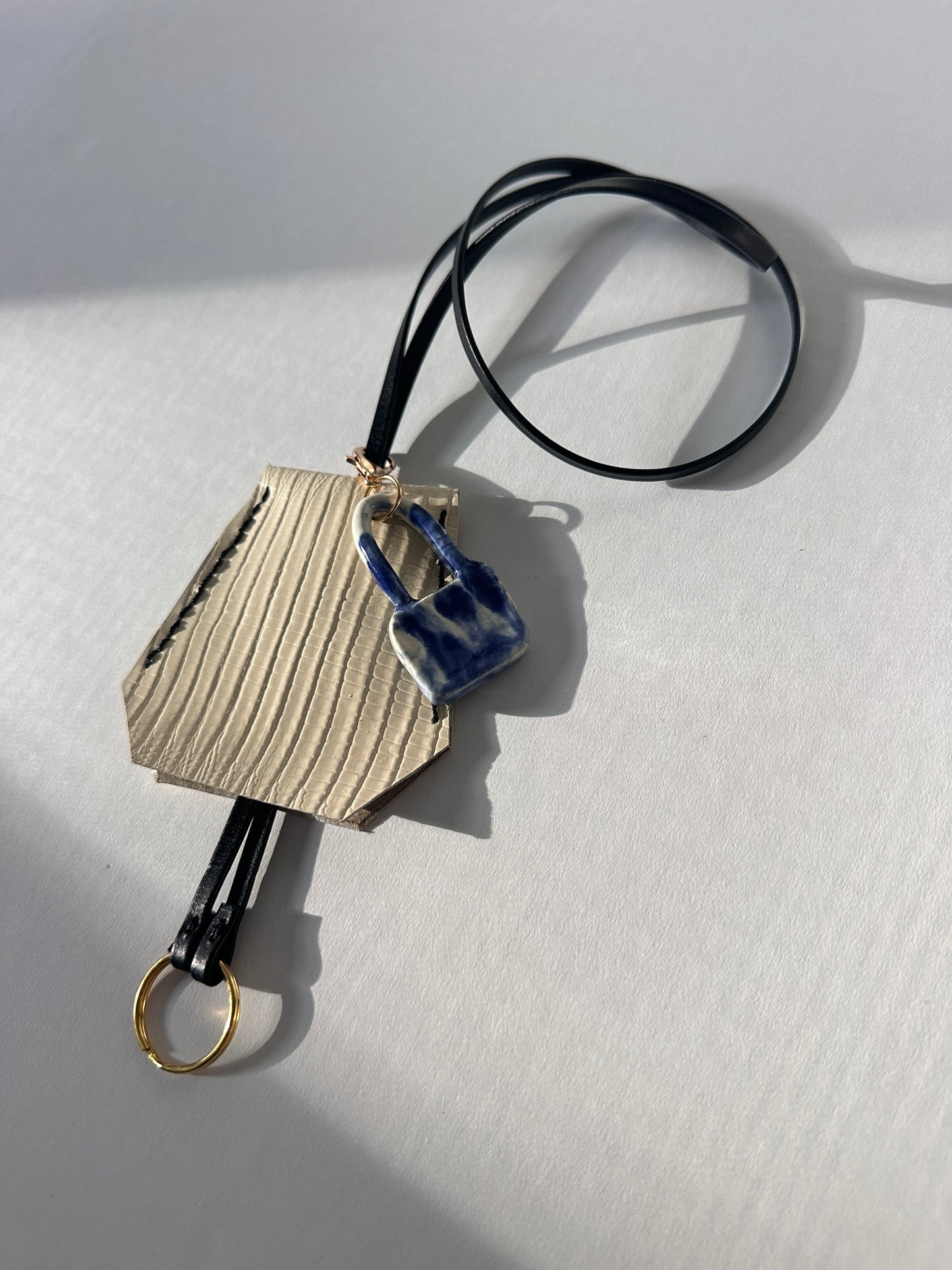 “Alice’s World” Leather Clochette with ceramic padlock