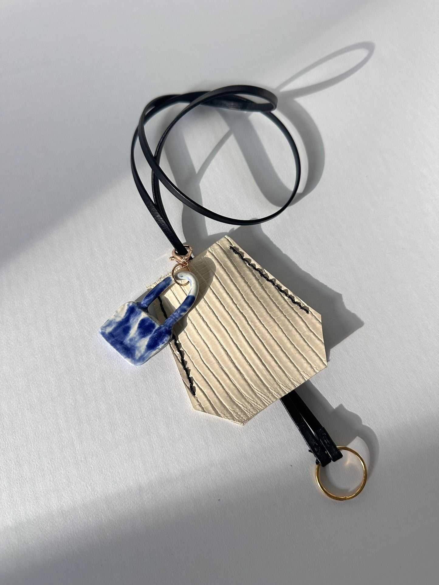 “Alice’s World” Leather Clochette with ceramic padlock