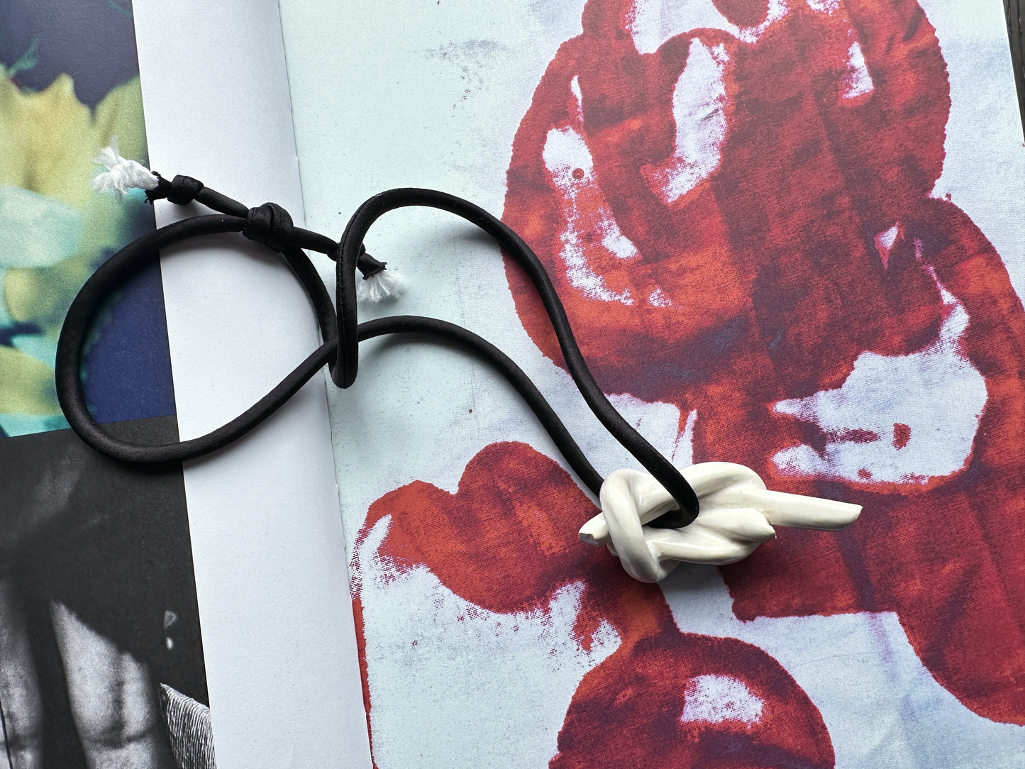 Ceramic knot pendant with black silk cord