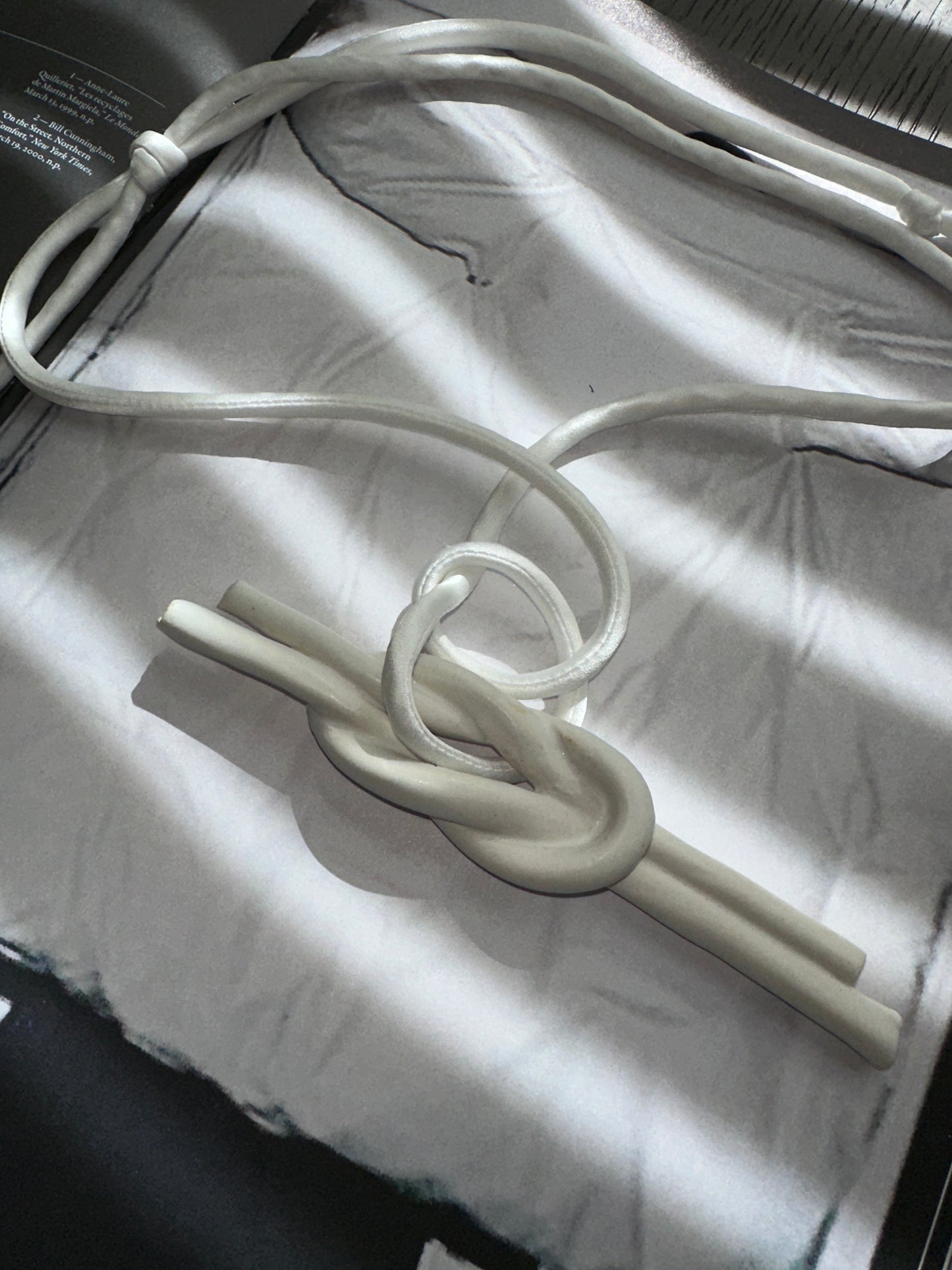 Ceramic Knot Pendant with Off White Silk Cord