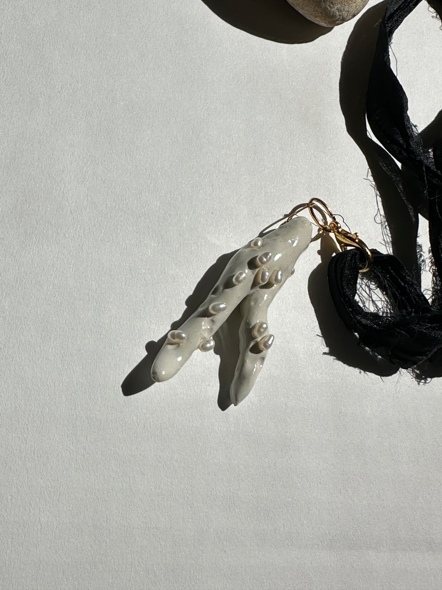 Pearl-Studded Ceramic Driftwood Pendant on Raw Silk Cord