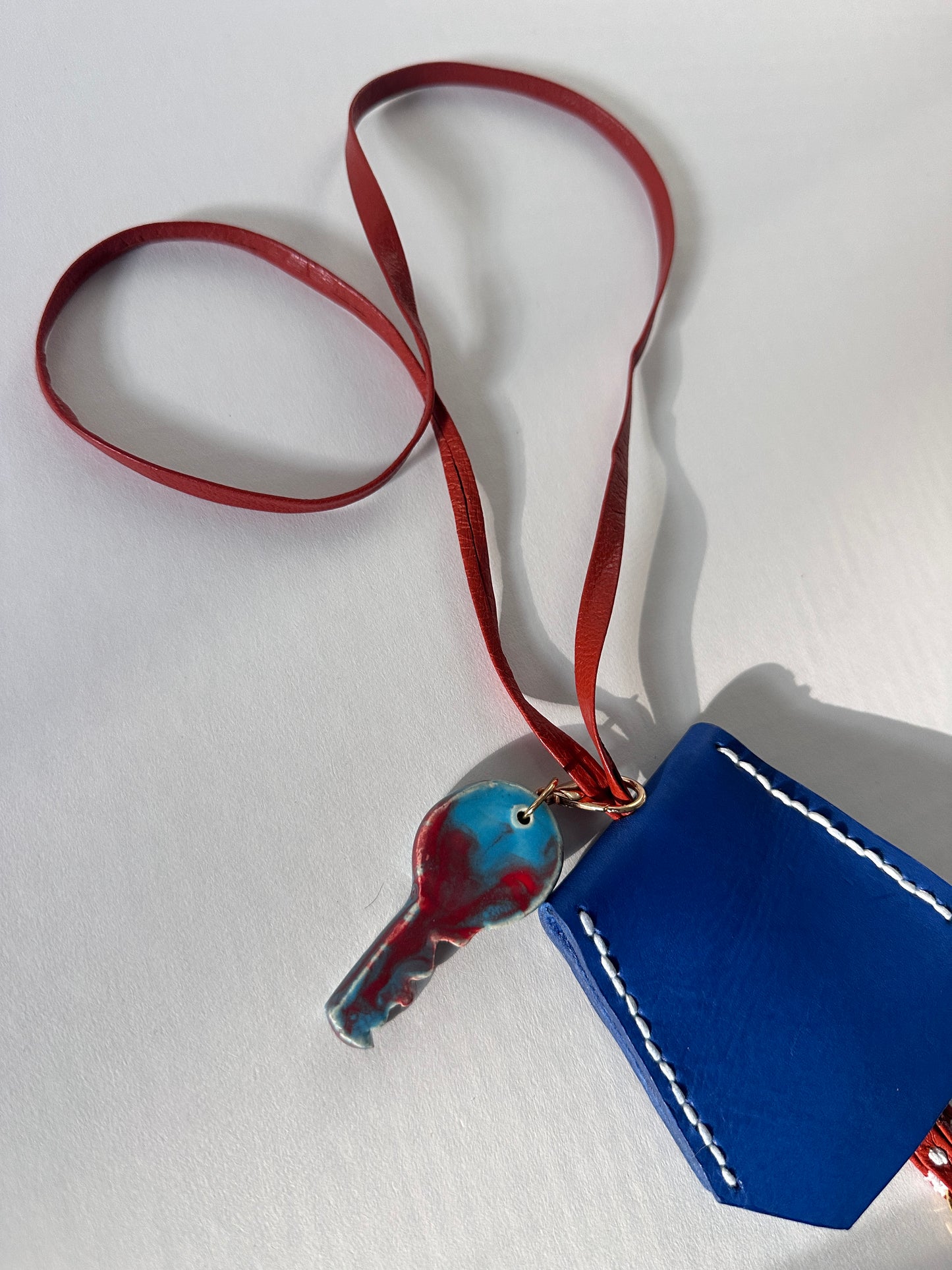 “Alice’s World” Leather Clochette with ceramic key