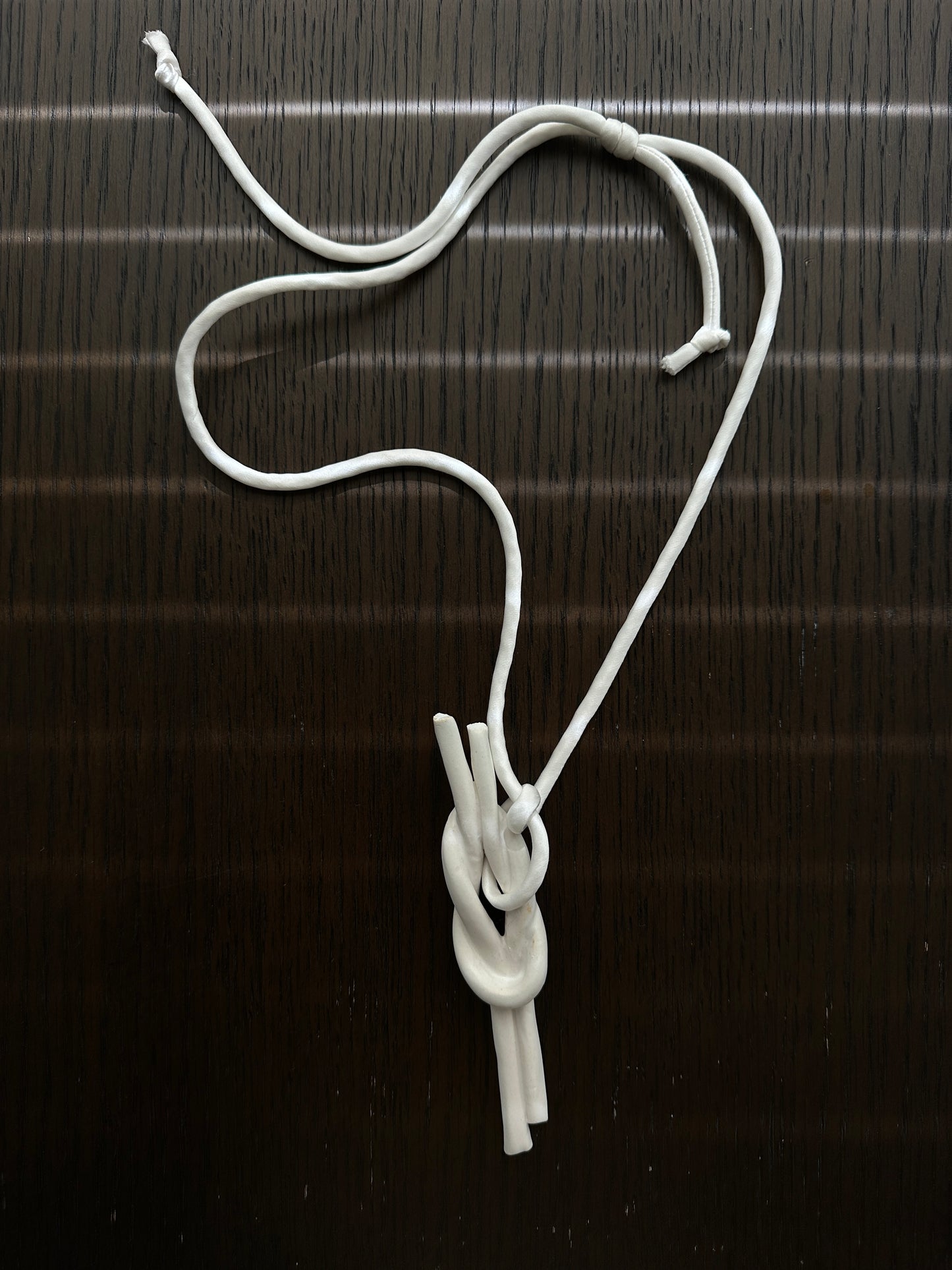 Ceramic Knot Pendant with Off White Silk Cord