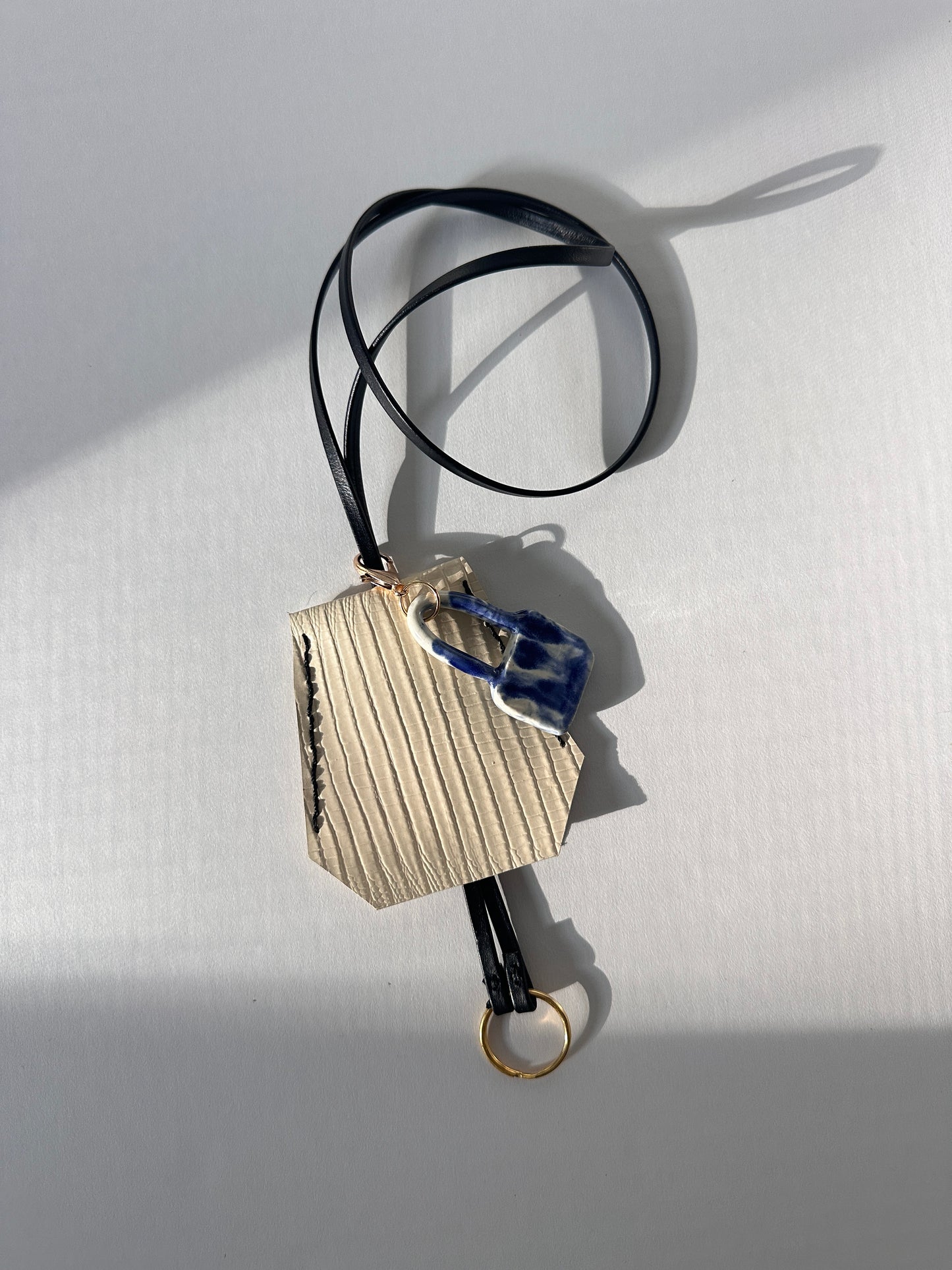 “Alice’s World” Leather Clochette with ceramic padlock
