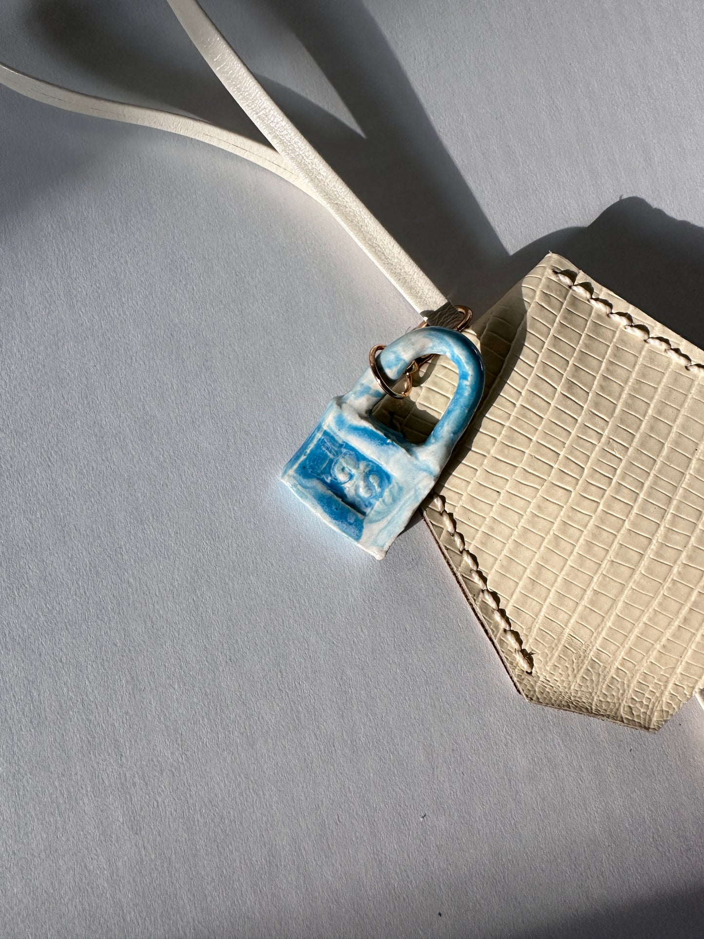 “Alice’s World” Leather Clochette with ceramic padlock