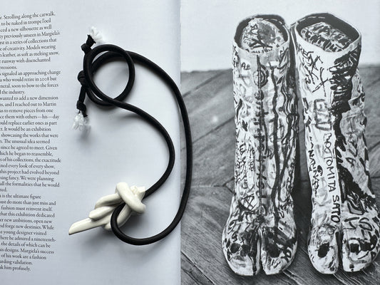 Ceramic knot pendant with black silk cord