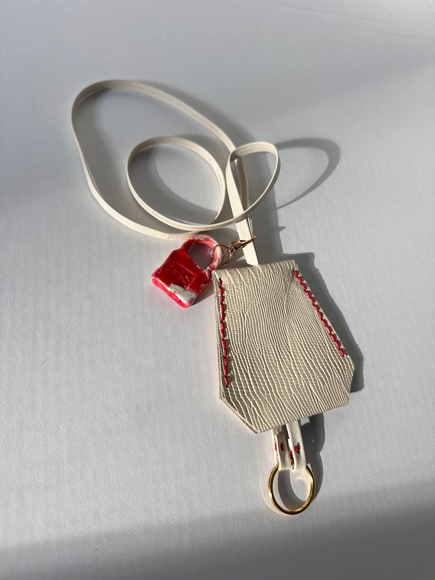 “Alice’s World” Leather Clochette with ceramic padlock