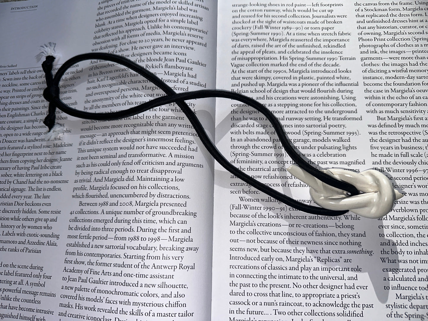 Ceramic knot pendant with black silk cord